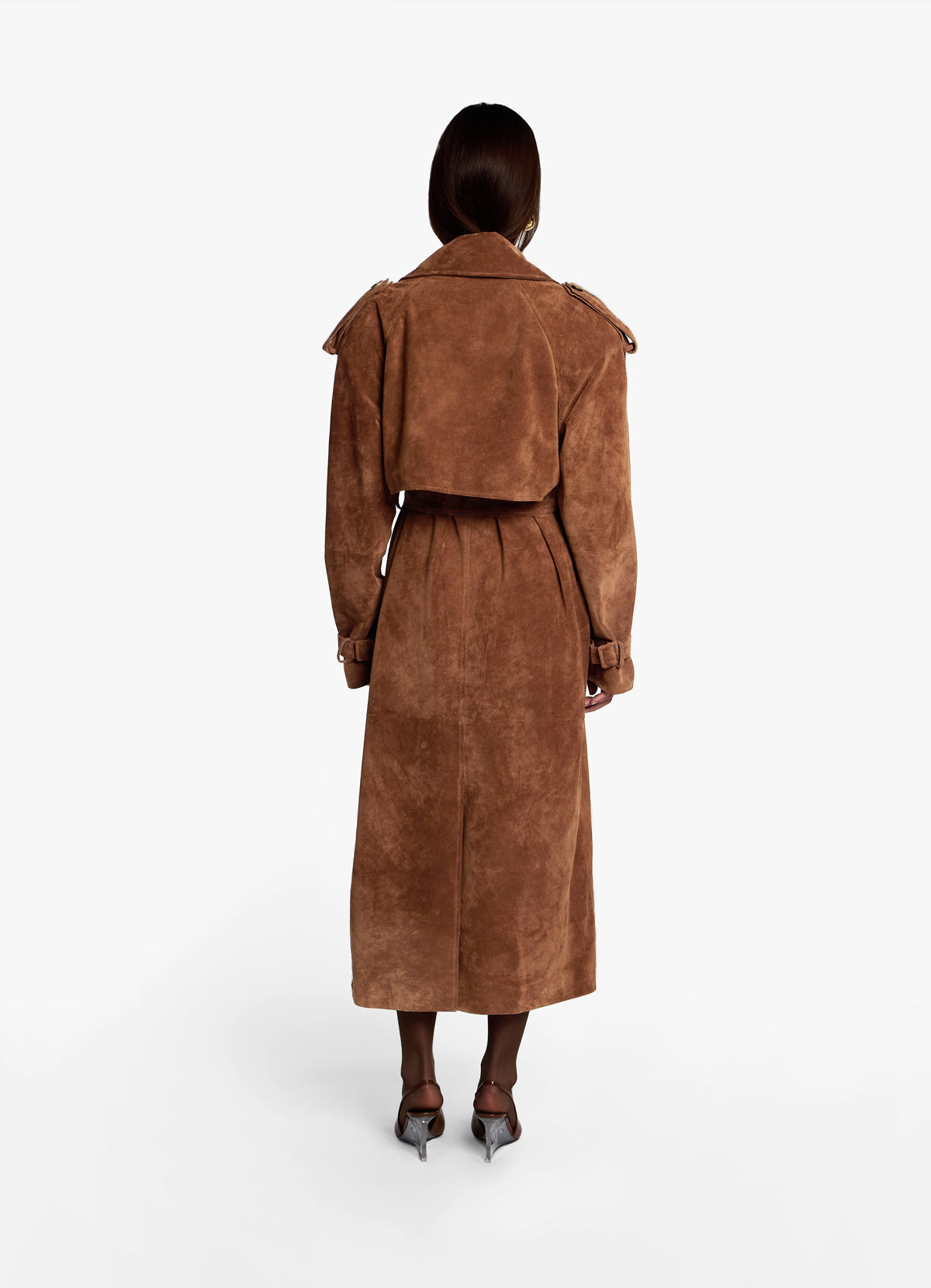 Back view of the mocha suede trench coat, model facing away to show back vent and length. 